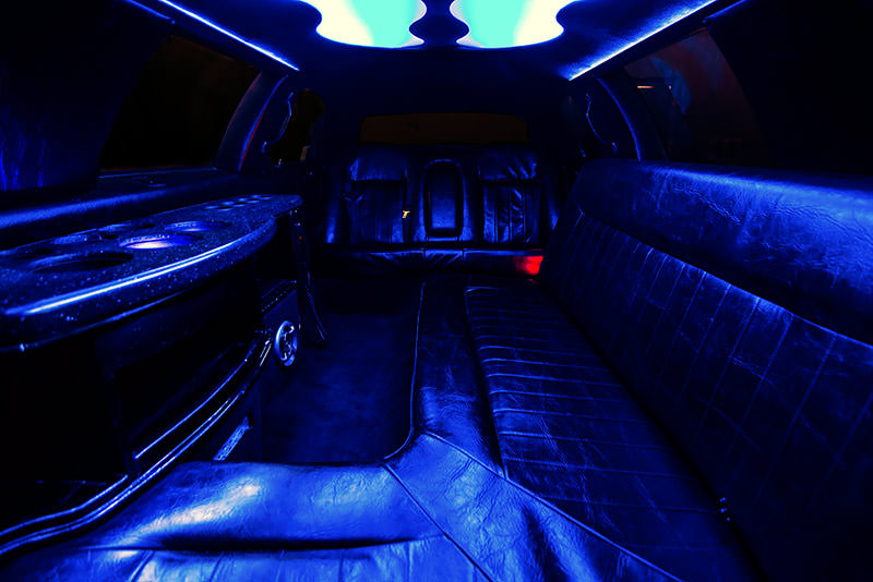 The view facing the front of the vehicle, as the light colors the black leather interior.