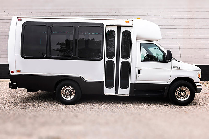 14 passenger white & dark grey Grand Rapids party bus exterior photo.
