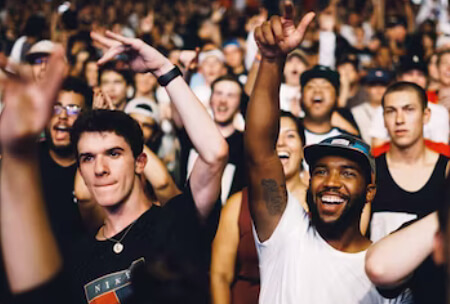 Concert goers cheer on their favorite band