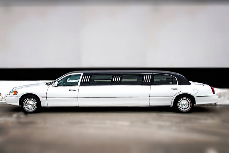 Luxurious white Lincoln Town Car stretch limo