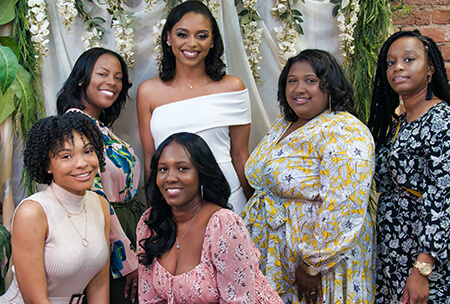 A group of ladies pose for a photo on their bachelorette party trip