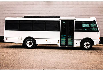 A clean white party bus exterior.